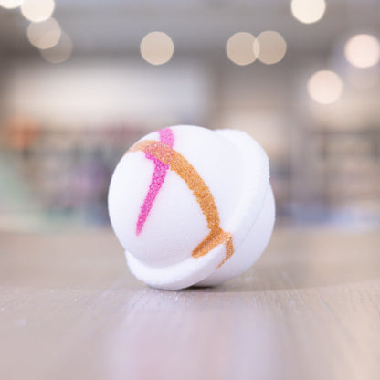 Pink orange design on white circle bath bomb