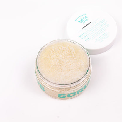 Open can of Buff City Soap's love potion body scrub with its lid next to it