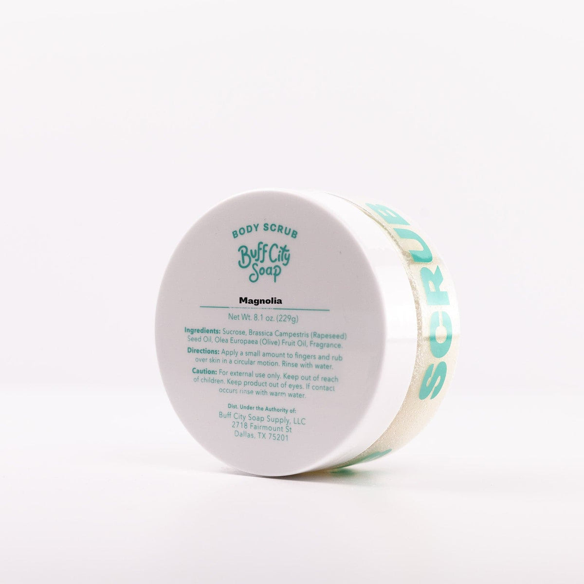 Magnolia Body Scrub in container angled on side with white lid